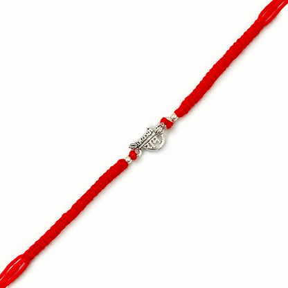 Shree Ram silver Rakhi with red braided thread and silver centerpiece
