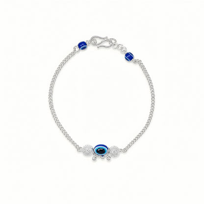 Silver Bhabhi Rakhi with blue evil eye design for Raksha Bandhan
