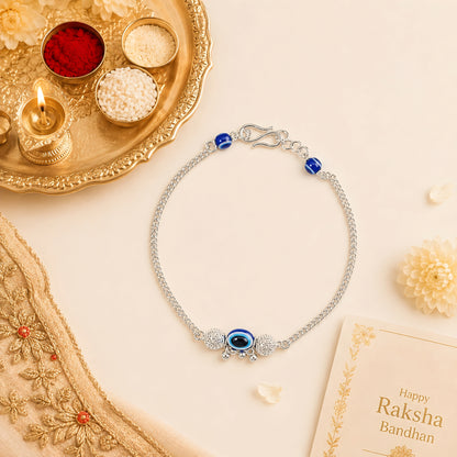 Silver Bhabhi Rakhi with blue evil eye design for Raksha Bandhan