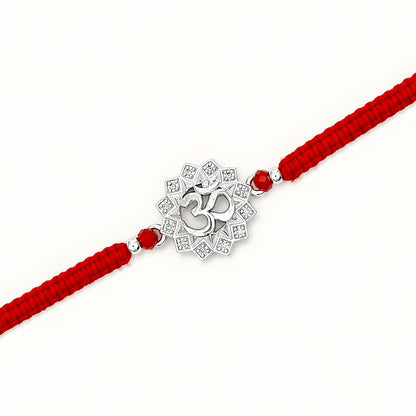 Om silver Rakhi with lotus design and red braided thread for brother