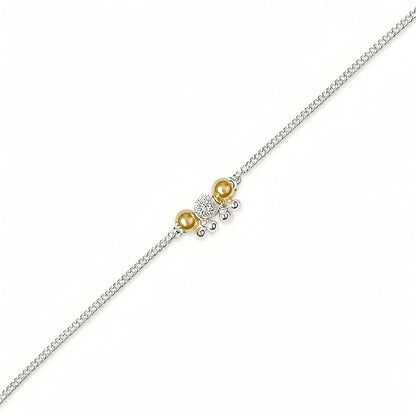 Silver Bhabhi Rakhi with blue evil eye beads and gold-tone beads