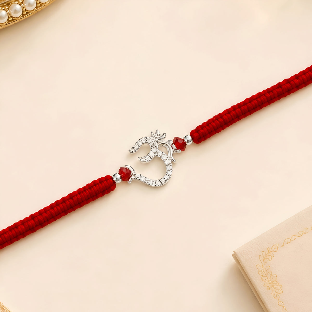 Om 925 silver Rakhi with red braided thread for brother
