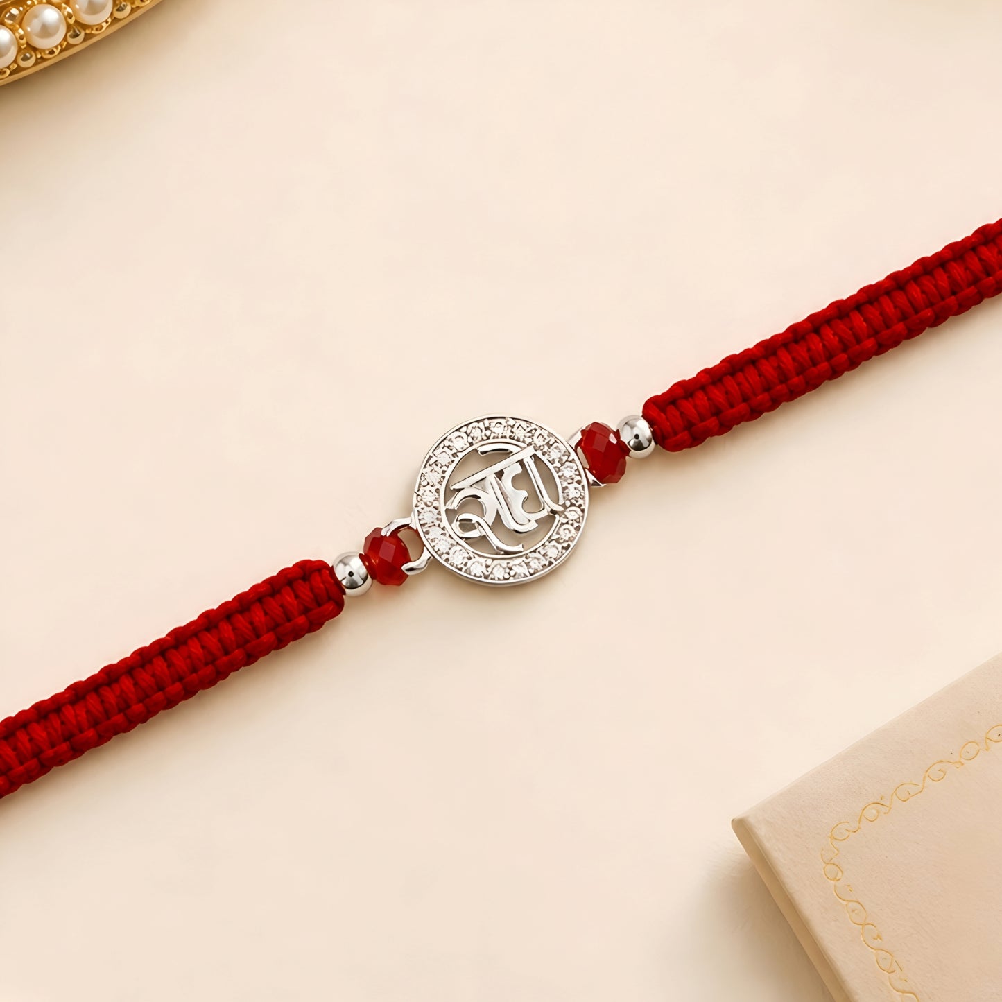 925 silver Radhe Rakhi with red braided thread for brother