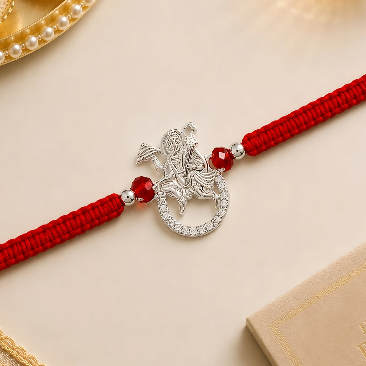 92.5 Silver Hanumanji Rakhi with red beads and red braided thread