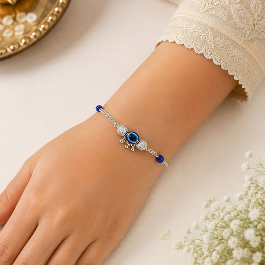 Silver Bhabhi Rakhi with Blue Evil Eye Design
