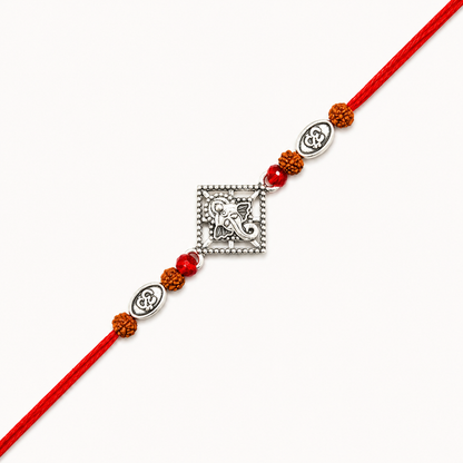 Silver Ganesh Om Rudraksha Rakhi with original Rudraksha beads, Om charms, and handcrafted red thread for Raksha Bandhan