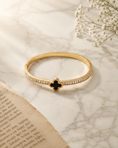 Gold plated black clover crystal bangle bracelet for women with sparkling zircon stones, worn on a model, perfect for daily wear and elegant styling.