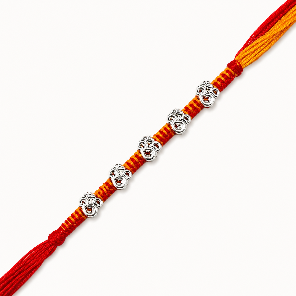 Silver Panch Om Rakhi featuring five sacred Om silver charms on a handcrafted red and yellow braided thread for Raksha Bandhan
