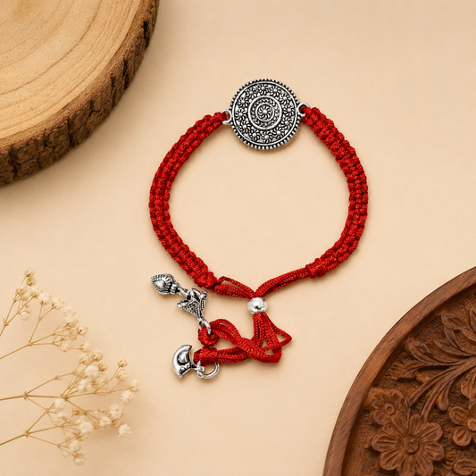 Sterling Silver Mandala Lumba Rakhi for Bhabhi with antique floral medallion, red woven thread and hanging silver charms