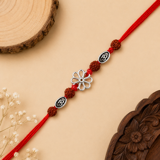Silver floral Om Rakhi with original Rudraksha beads and red thread for brother on Raksha Bandhan