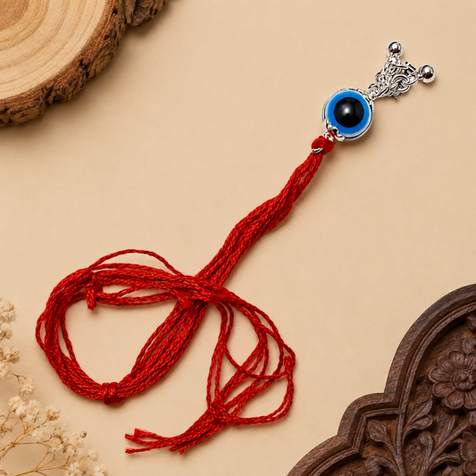Sterling Silver Nazar Lumba Rakhi for Bhabhi with blue evil eye centrepiece, silver hanging charms and red thread