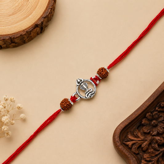 Silver Mahadev Trishul Rakhi with serpent motif, original Rudraksha beads and red thread for Raksha Bandhan