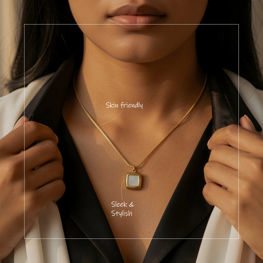 Minimal gold-tone square pendant necklace with a luminous white inlay on a delicate chain, elegant daily wear jewellery for women.