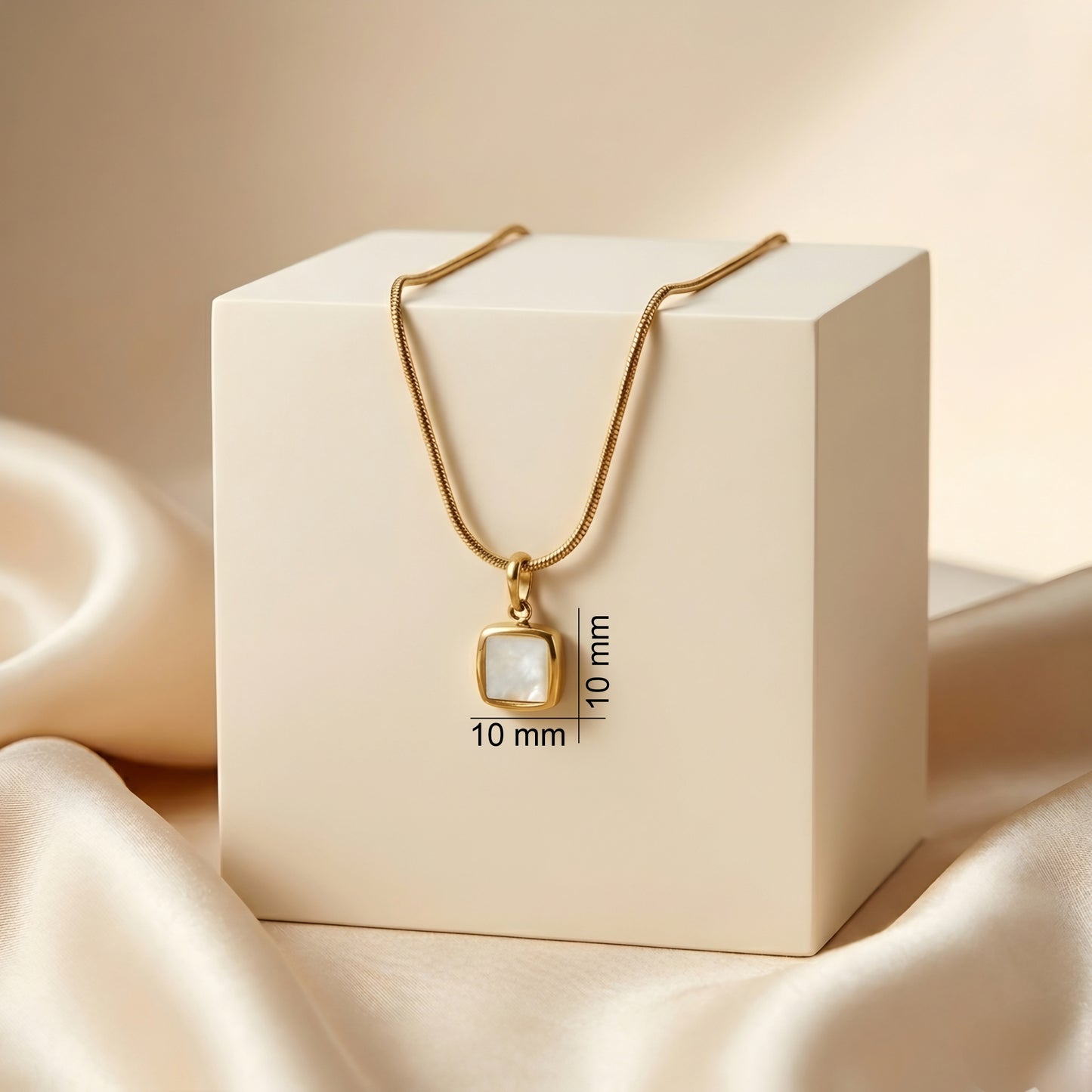 Minimal gold-tone square pendant necklace with a luminous white inlay on a delicate chain, elegant daily wear jewellery for women.