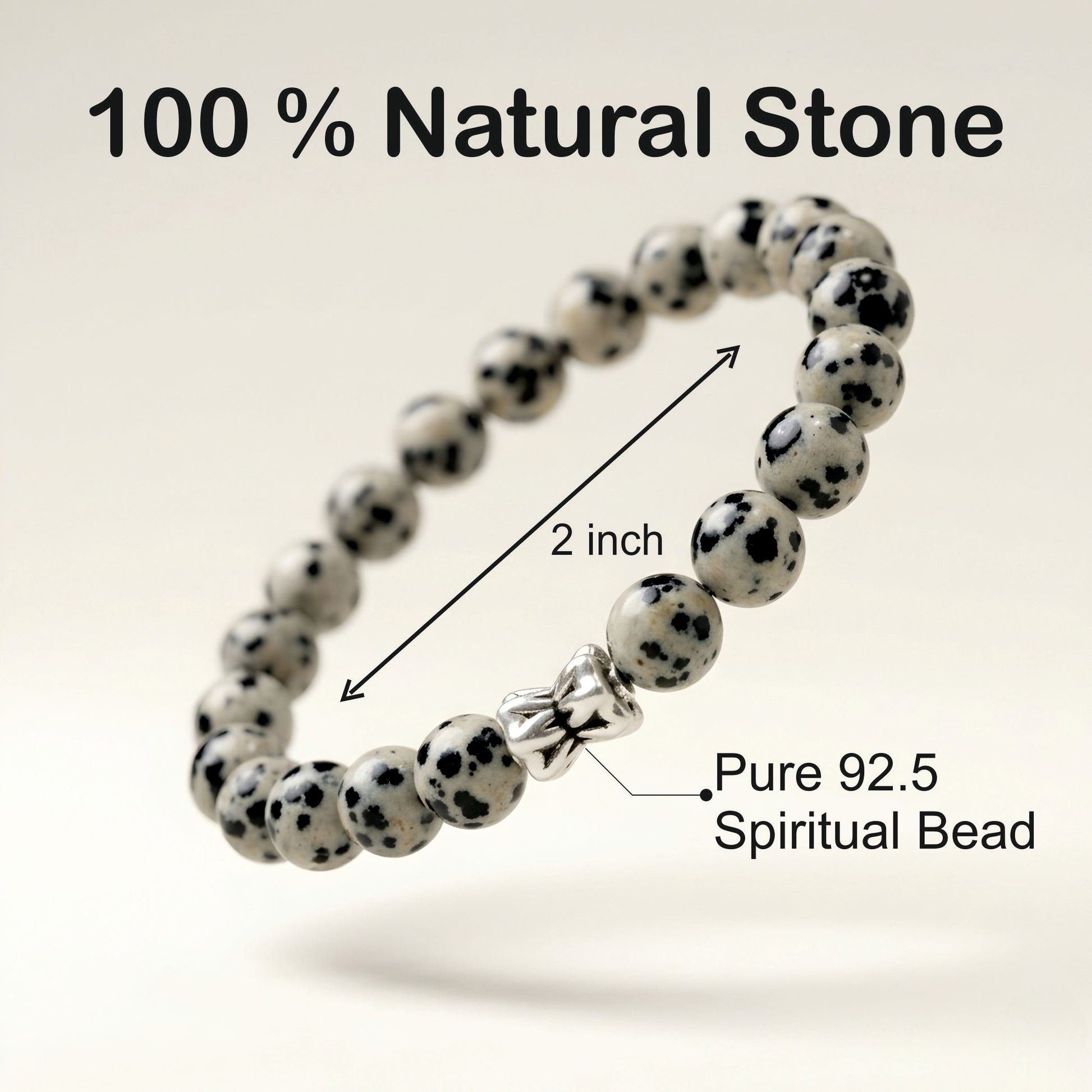 Natural Dalmatian Jasper bracelet featuring 8 mm cream and black speckled gemstone beads with a butterfly accent bead on a smooth stone background.