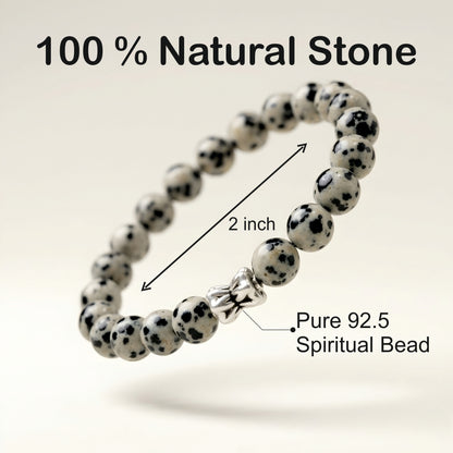 Natural Dalmatian Jasper bracelet featuring 8 mm cream and black speckled gemstone beads with a butterfly accent bead on a smooth stone background.