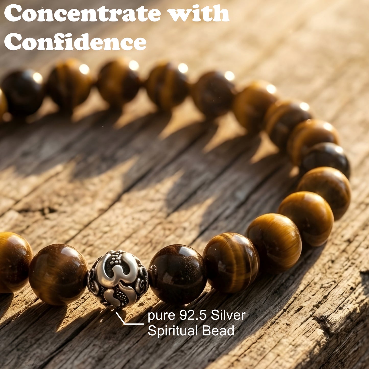 Natural Tiger Eye gemstone bracelet with premium silver accent bead worn on a wrist, featuring polished golden-brown stone beads.