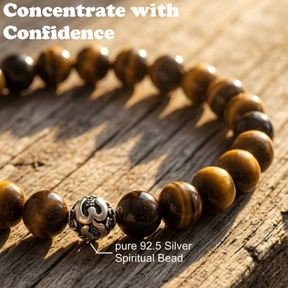 Natural Tiger Eye gemstone bracelet with premium silver accent bead worn on a wrist, featuring polished golden-brown stone beads.